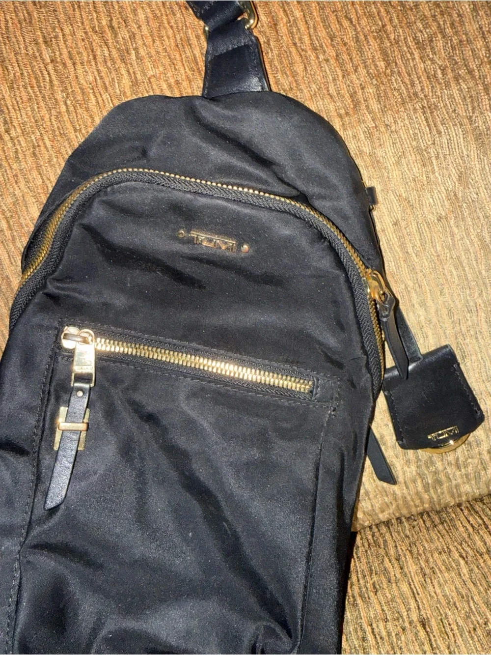 Tumi Black Sling Belt Bag with Gold Hardware